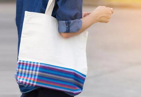 woman carrying tote bag ready for cancer treatment