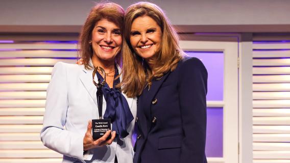 Camille Ruvo (left) was presented with an award by Maria Shriver.