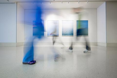abstract image of clinicians walking quickly