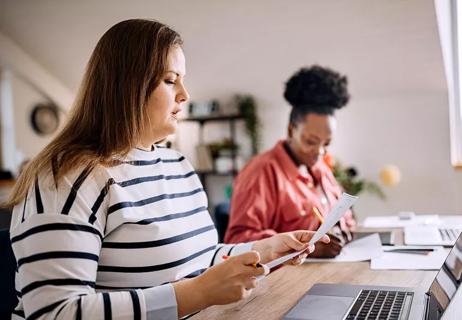 Overweight woman working in an office