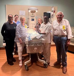 Charlie and Gerry Ruibal with neonatal staff at Cleveland Clinic Tradition Hospital.
