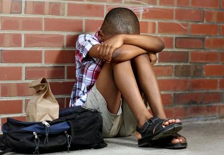 boy sad at school from bullying