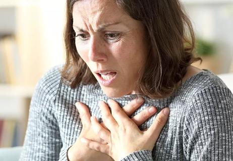 woman frightened with chest pain