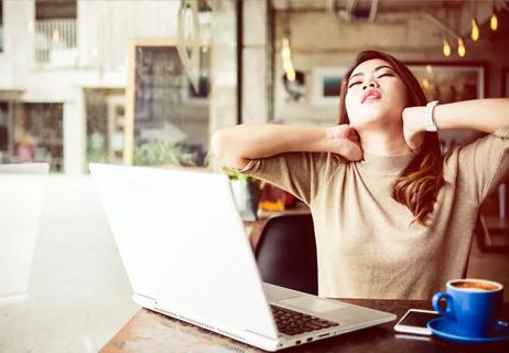 Woman at desk with neck pain