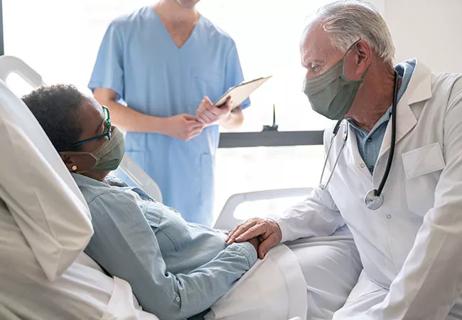 Doctors at patient's bedside