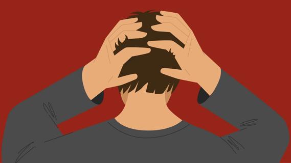 Person running their hands through their head in anger