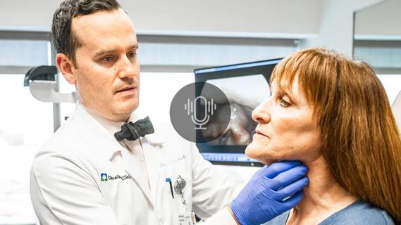 Doctor checking patient's throat