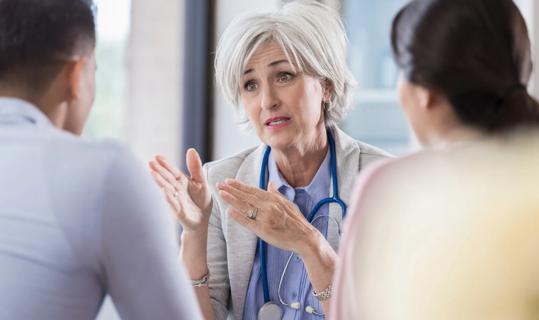 Healthcare provider talking with couple