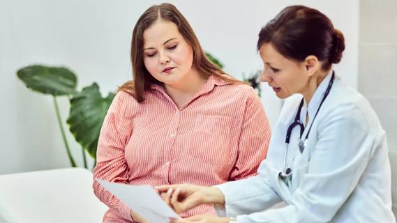 Physician consulting with patient on weight-management