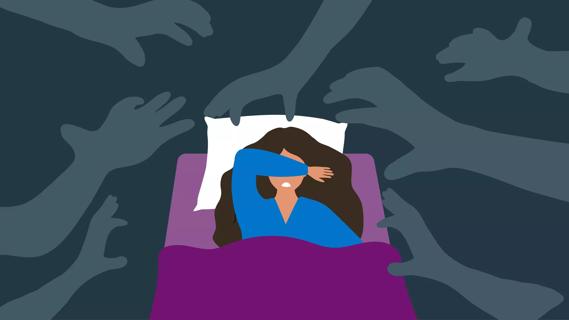 Person in bed experiencing nightmares