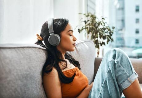 empathy fatiuged woman relaxing by listening to music
