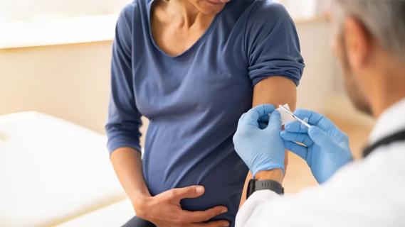 Pregnant woman receiving a vaccine