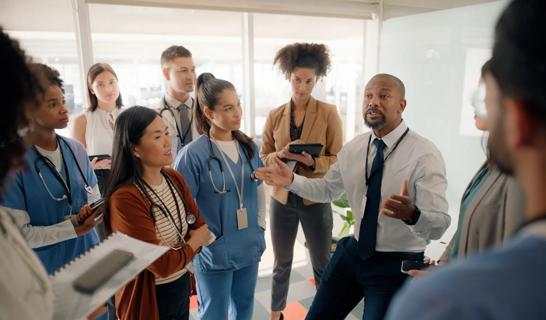 Healthcare workers standing around in a group