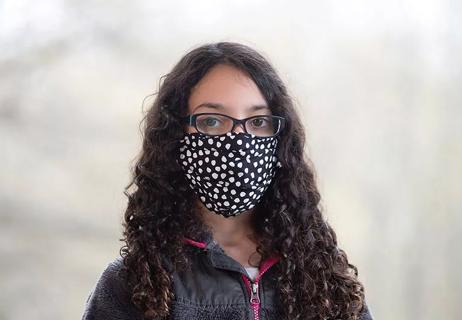 Teen girl wearing cloth face mask