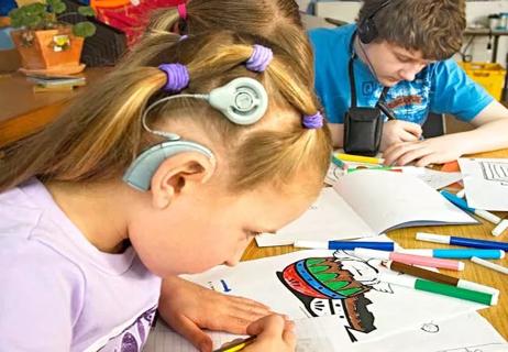 child with hearing aid