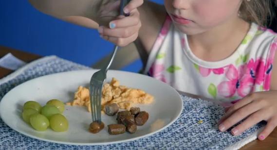 Child eating breakfast