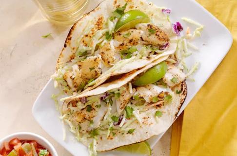 Two fish soft tacos on plate