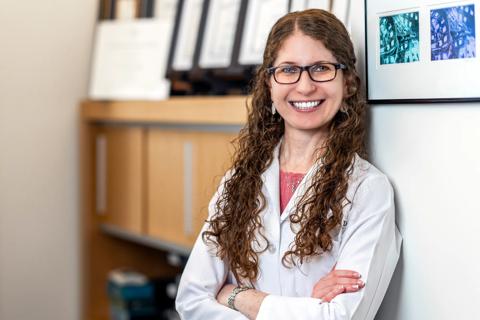 Dr. Carrie Hersh standing in an office