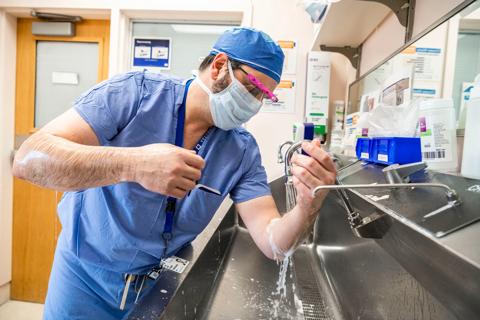 Doctor scrubbing before surgery