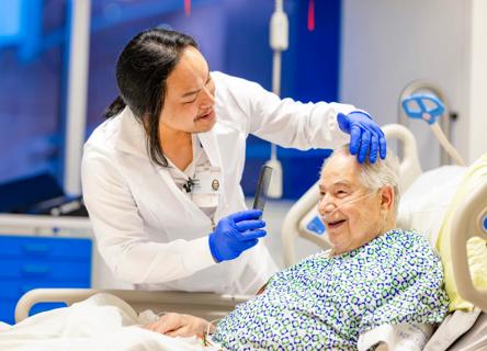 Nurse combing patient's hair