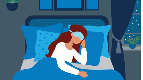 Person in bed asleep, wearing a sleep mask over their eyes