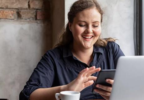 happy woman texting and laughing