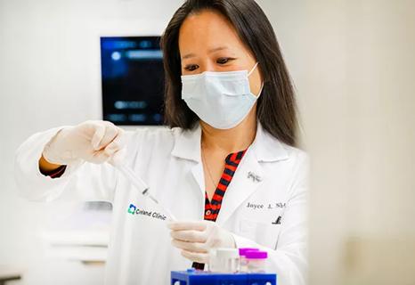 Dr. Joyce Shin demostrating a thyroid ultrasound and exam with patient.