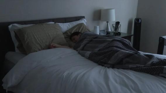 Person sleeping in bed