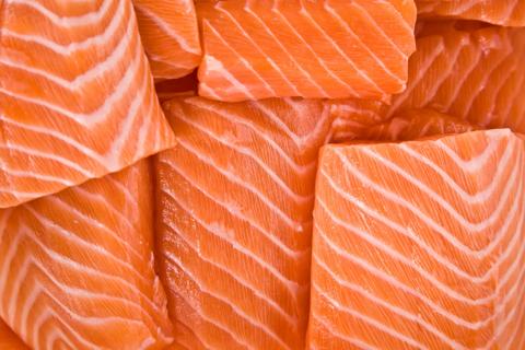 Raw salmon filets overlapping each other