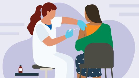 Healthcare provider giving a shot in a patient's shoulder