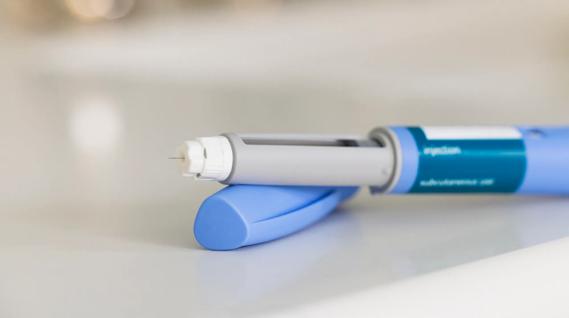 An uncapped GLP-1 injector on counter