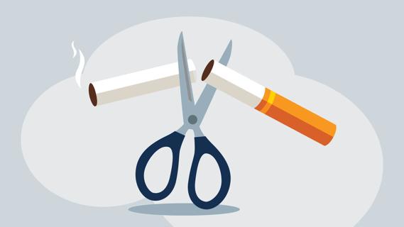 Scissors cutting a cigarette in half