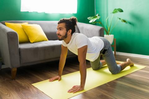 Person doing a somatic yoga exercise