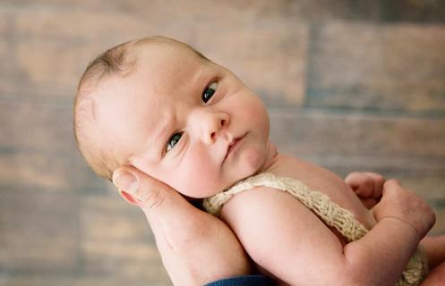 Newborn baby with crossing eyes