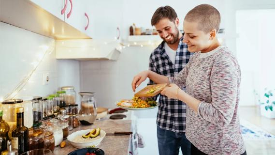 Young couple cooking