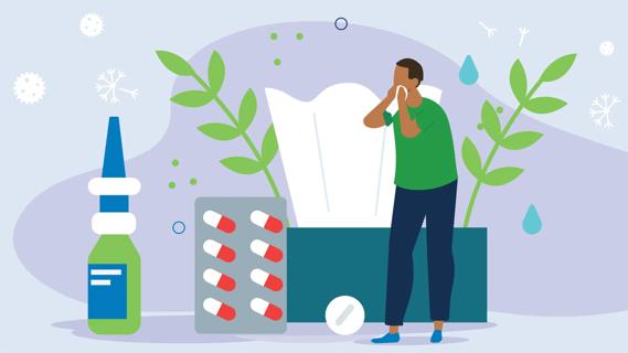 Person blowing their nose, surrounded by giant allergens, allergy medications and box of tissues