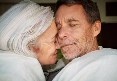 Older couple cuddling and affectionate