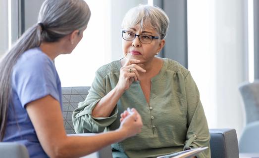 Healthcare provider having a serious discussion with patient