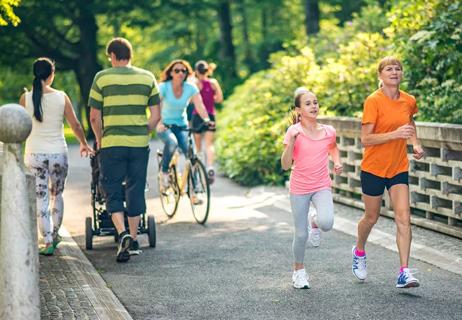 People running and walking in the park