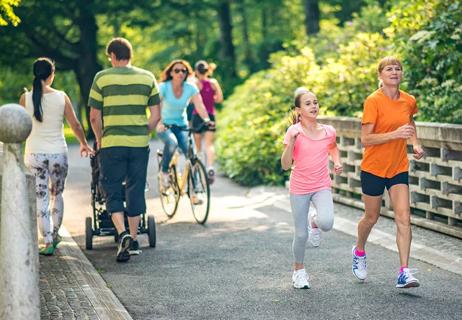 People running and walking in the park