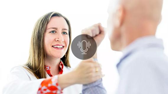 doctor applying force to patient's forearm to test strength
