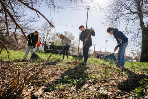People landscaping during clean up event