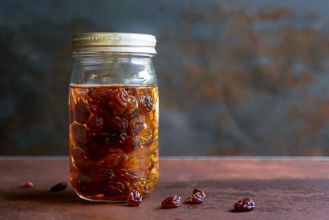 Mason jar filled with water and raisins