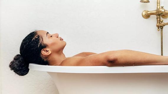 Person relaxing in bathtub