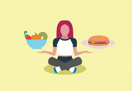 Person holding up a bowl of fruit and a hamburger.