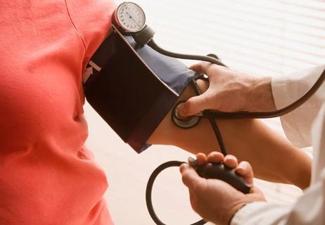 woman getting her blood pressure checked