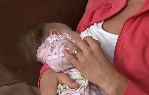 Woman breastfeeding baby