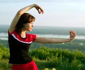 A woman doing tai chi.