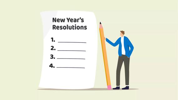 person writing a New Year's resolution goal list