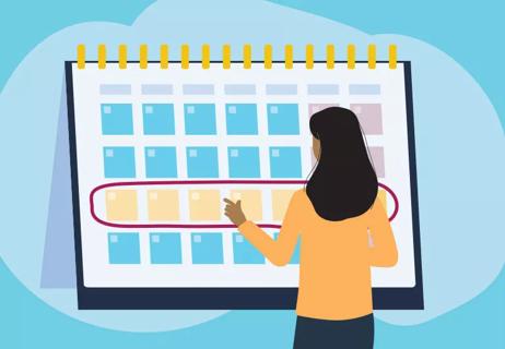 woman checking menstrual cycle on calendar